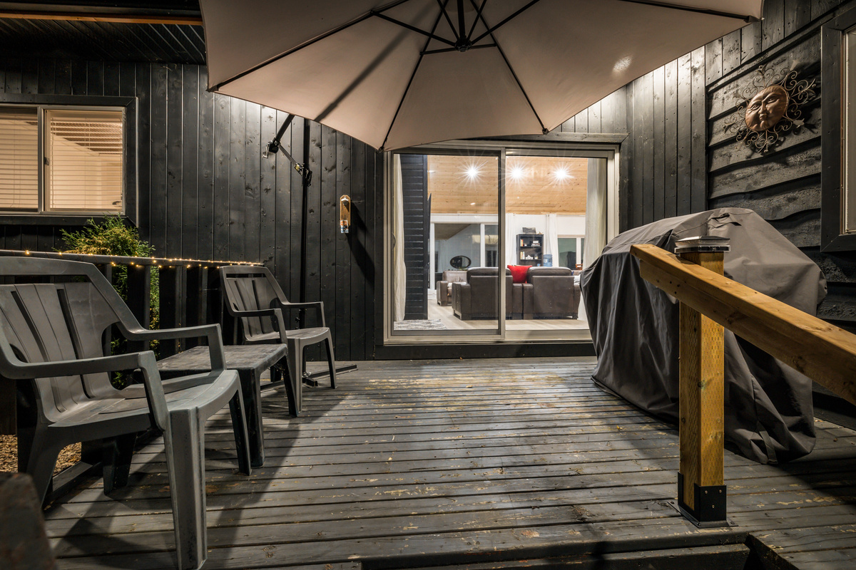 The rear deck is a relaxed spot for grilling, sitting outside, and enjoying the quiet evening atmosphere just steps from the kitchen.