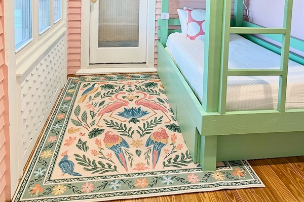 Bright coastal bunk room with built-in twin bunks—perfect for kids or extra guests.