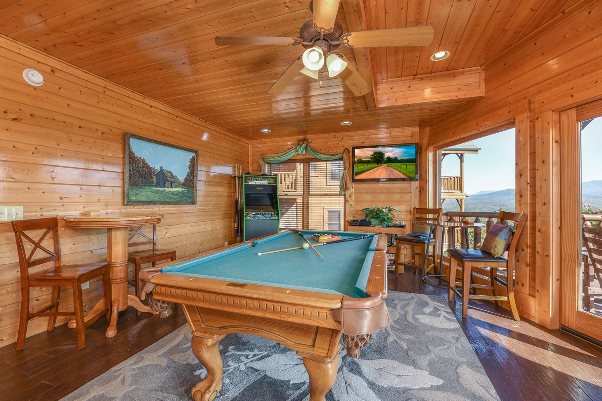 - Game room featuring pool, arcade fun, and panoramic Smoky Mountain scenery   - Gather with family and friends in this entertainment-filled cabin retreat   - Rustic charm meets mountain excitement in this lively recreation space