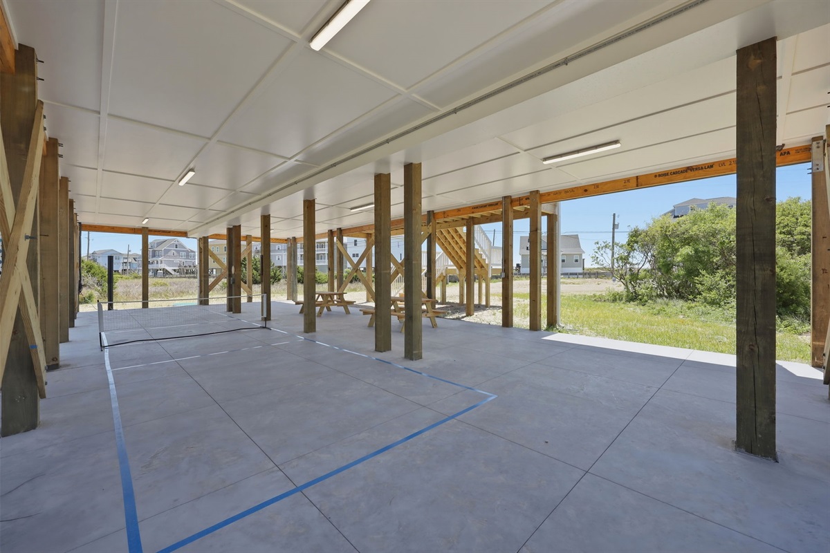 Spacious shaded area with picnic seating; ideal for meals, games, and relaxing together