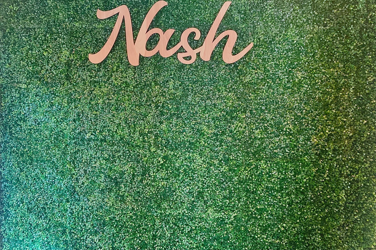 - Vibrant faux greenery wall with “Nash” lettering sets the perfect photo backdrop - Adds personality and local charm to the home’s entry or social zone - Fun and stylish spot to snap a pic and share your Nashville stay
