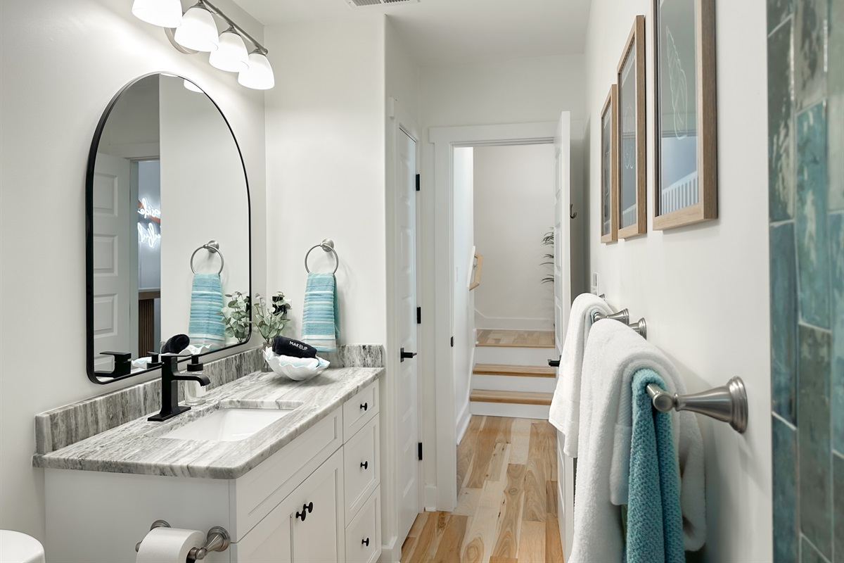 The downstairs bathroom has a large vanity.
