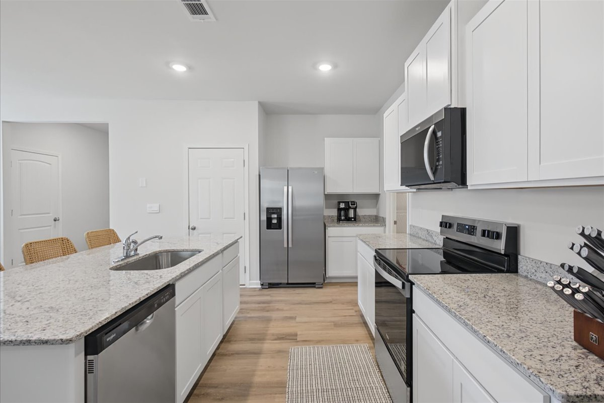 Plenty of counter space, a dishwasher, and a deep sink for easy cleanup