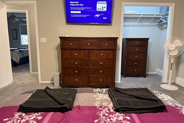 Queen bed with large Roku TV