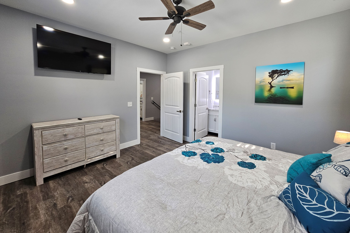 Spacious king suite with smart TV and private bath.