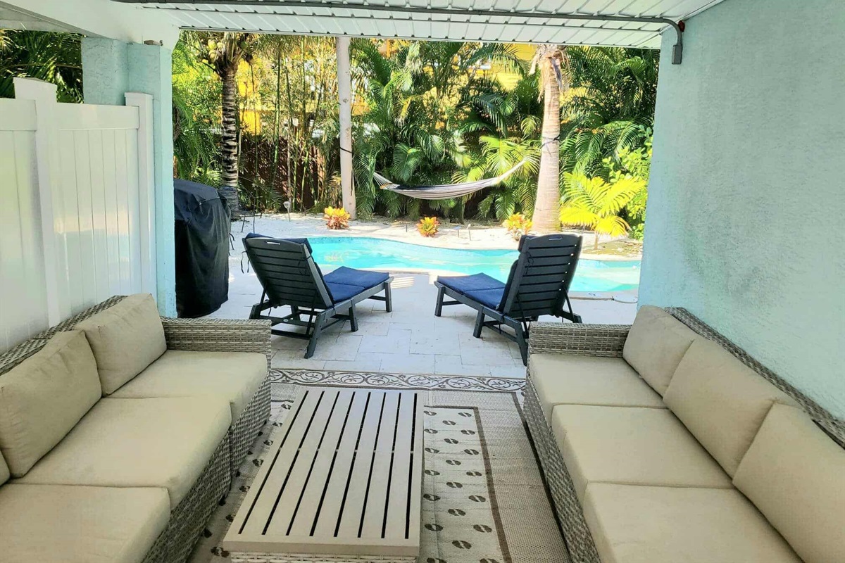 Day side - nice outdoor furniture in the shade by the pool, with grill