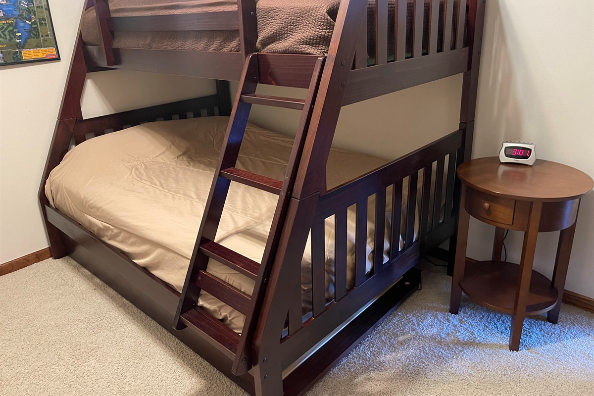 Twin over full bunk bed with twin trundle.