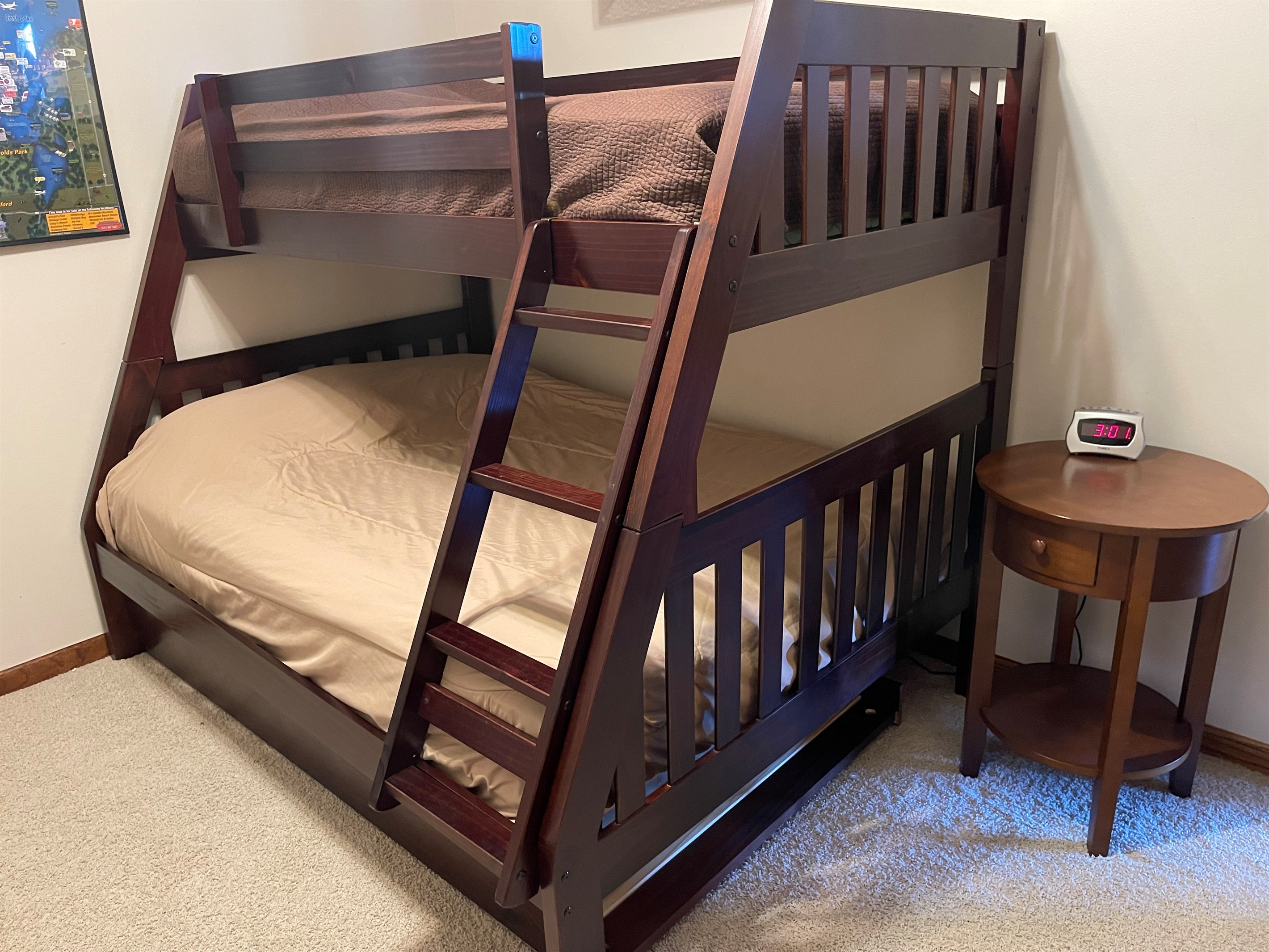 Twin over full bunk bed with twin trundle.