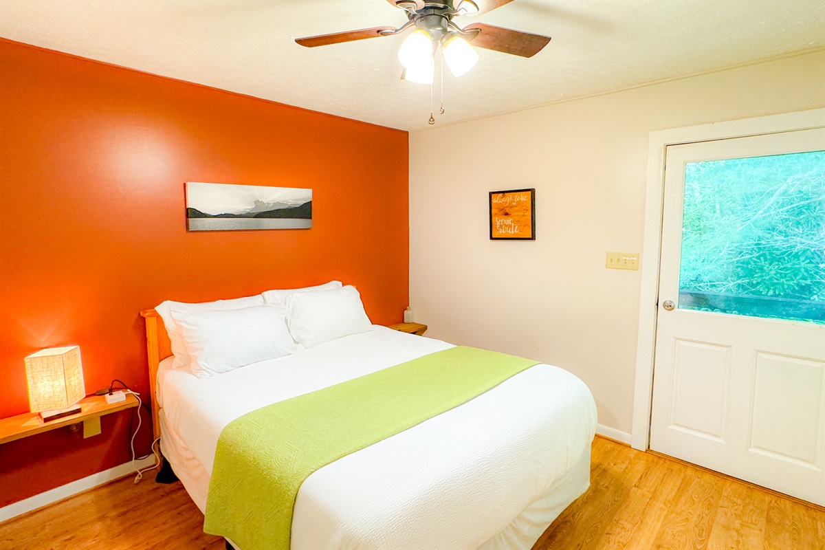 upstairs bedroom at the ol gun range cabin features a comfy queen bed