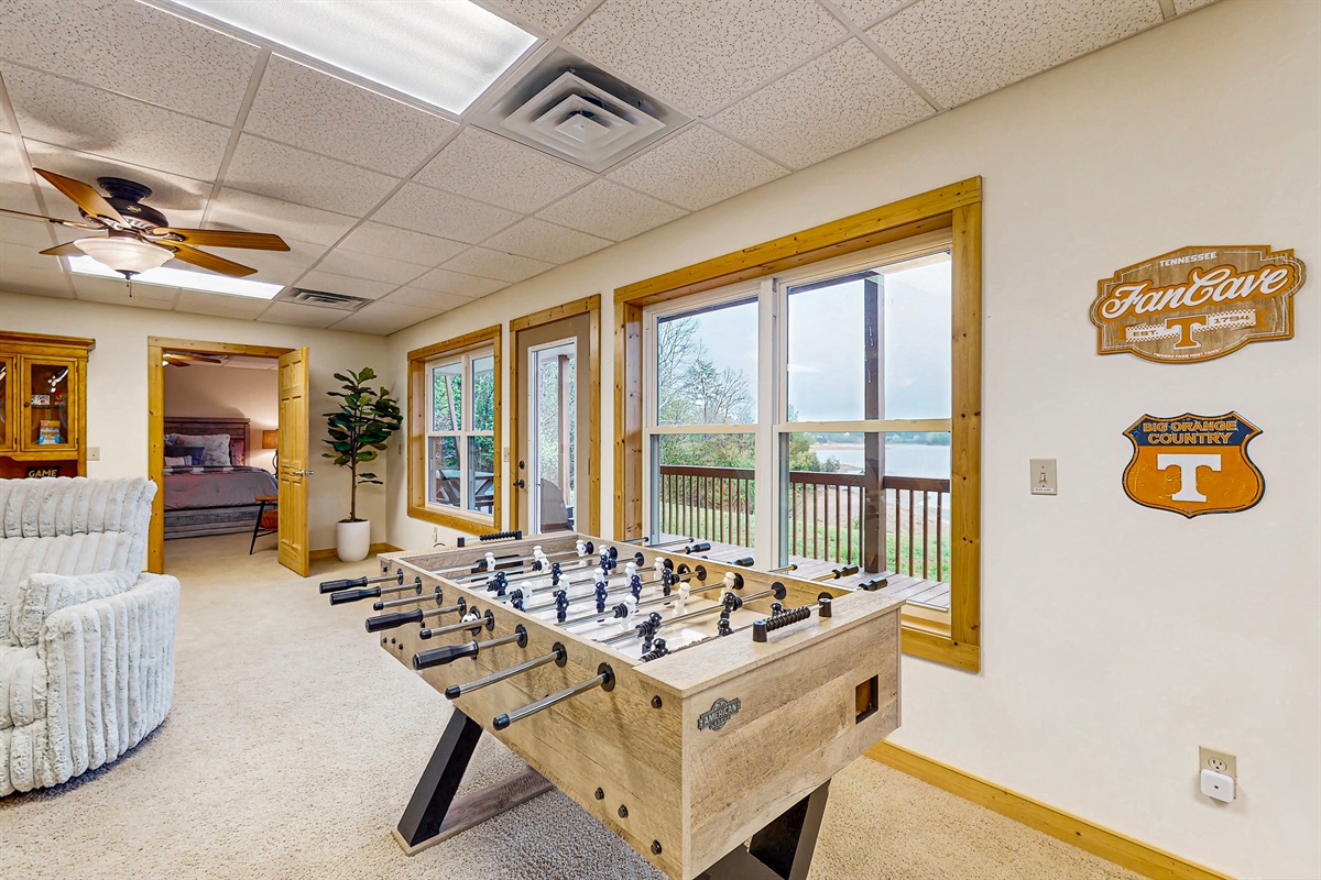 Large gathering space with game (foosball, Pool and shuffleboard) cozy couch and big screen TV