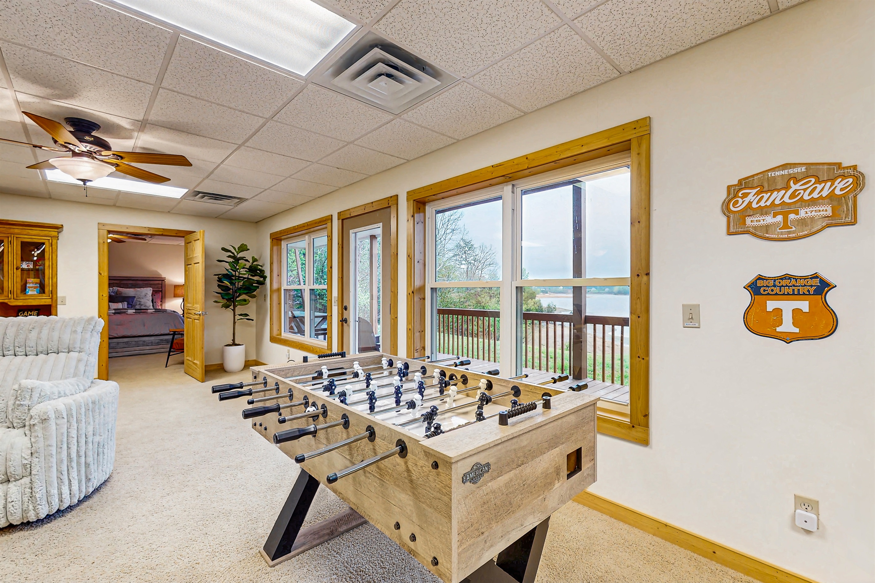 Large gathering space with game (foosball, Pool and shuffleboard) cozy couch and big screen TV