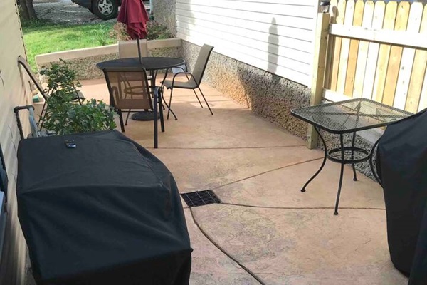 Patio area between the entrance to through the kitchen and the garage. We have both a Griddle Grill AND a propane BBQ Grill.