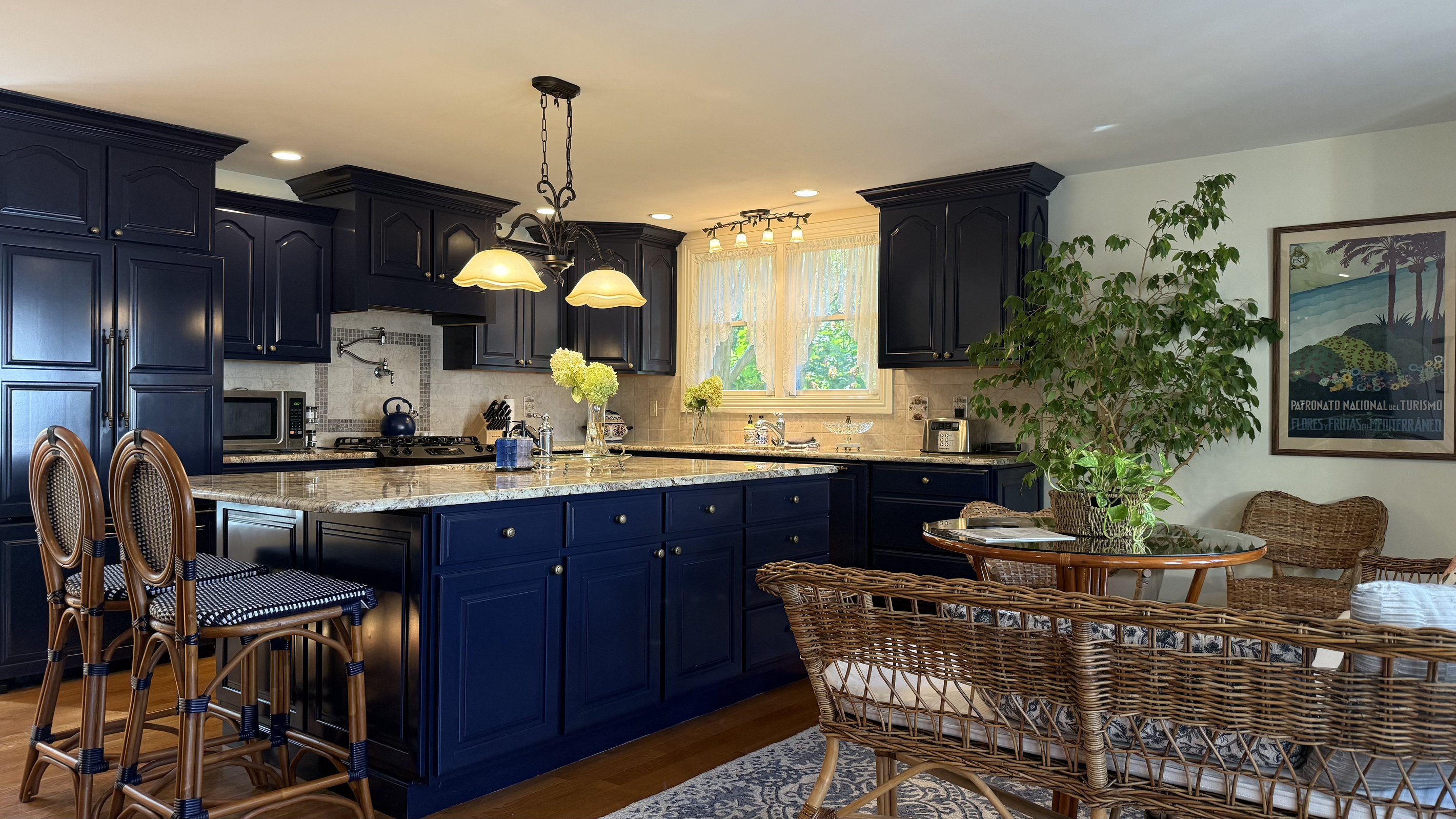 A fully renovated kitchen with granite island, professional appliances, and plenty of room for the whole group to gather. Open to the sitting area so no one misses the conversation.
