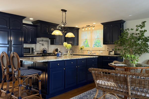A fully renovated kitchen with granite island, professional appliances, and plenty of room for the whole group to gather. Open to the sitting area so no one misses the conversation.