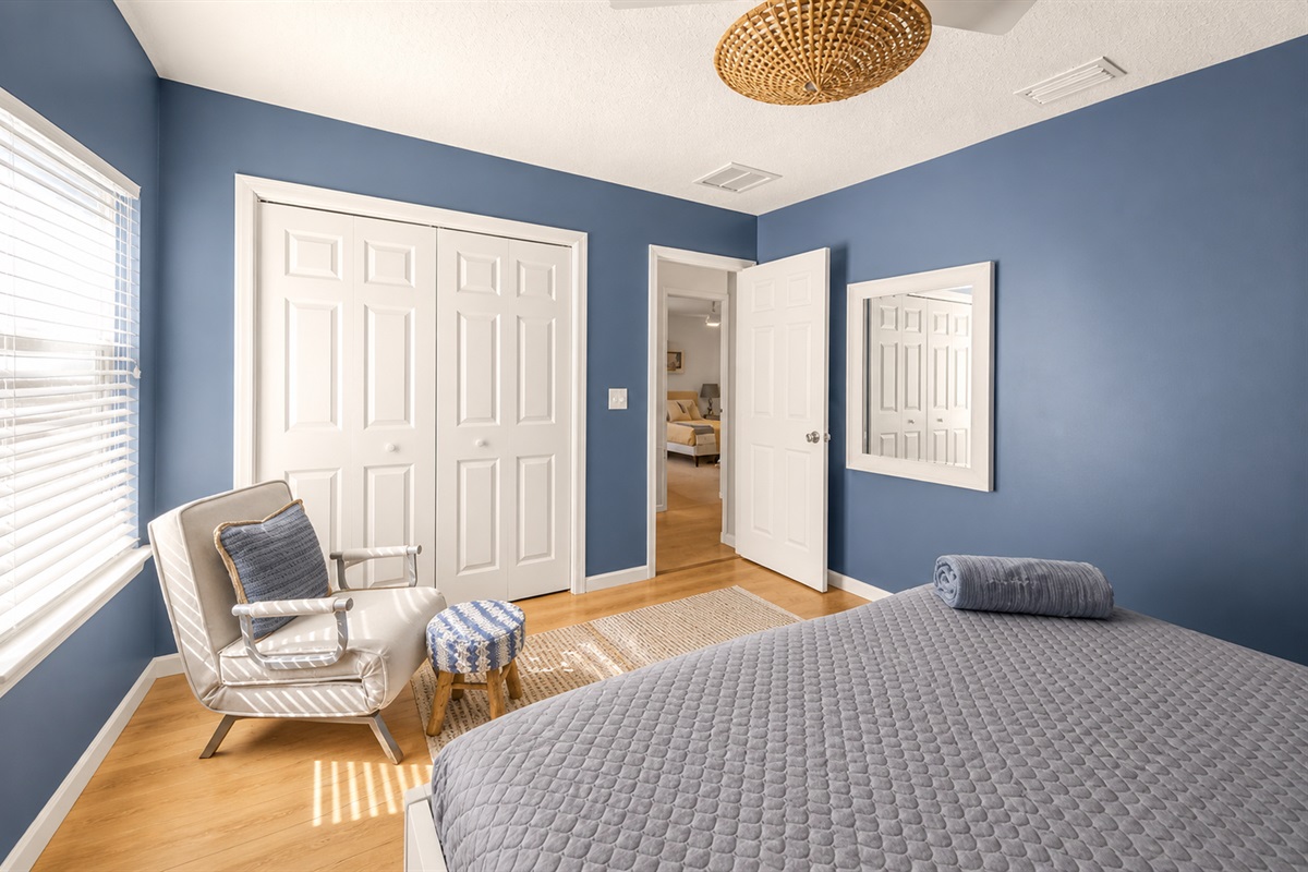 Reading chair and large closet with doors 