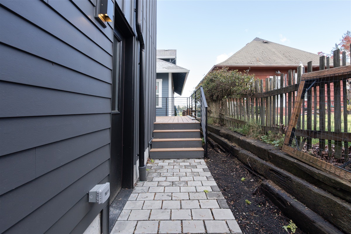 Lighted path on the left of the home takes you to the entrance.