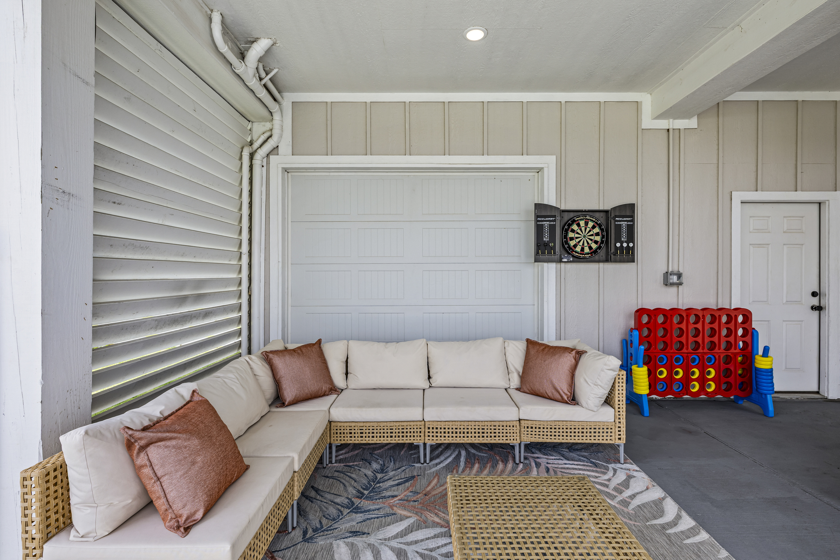 Outdoor Lounge & Dart Game
Kick back on the comfortable outdoor sectional, challenge friends to a game of darts, and enjoy quality time together in this inviting backyard entertainment space.