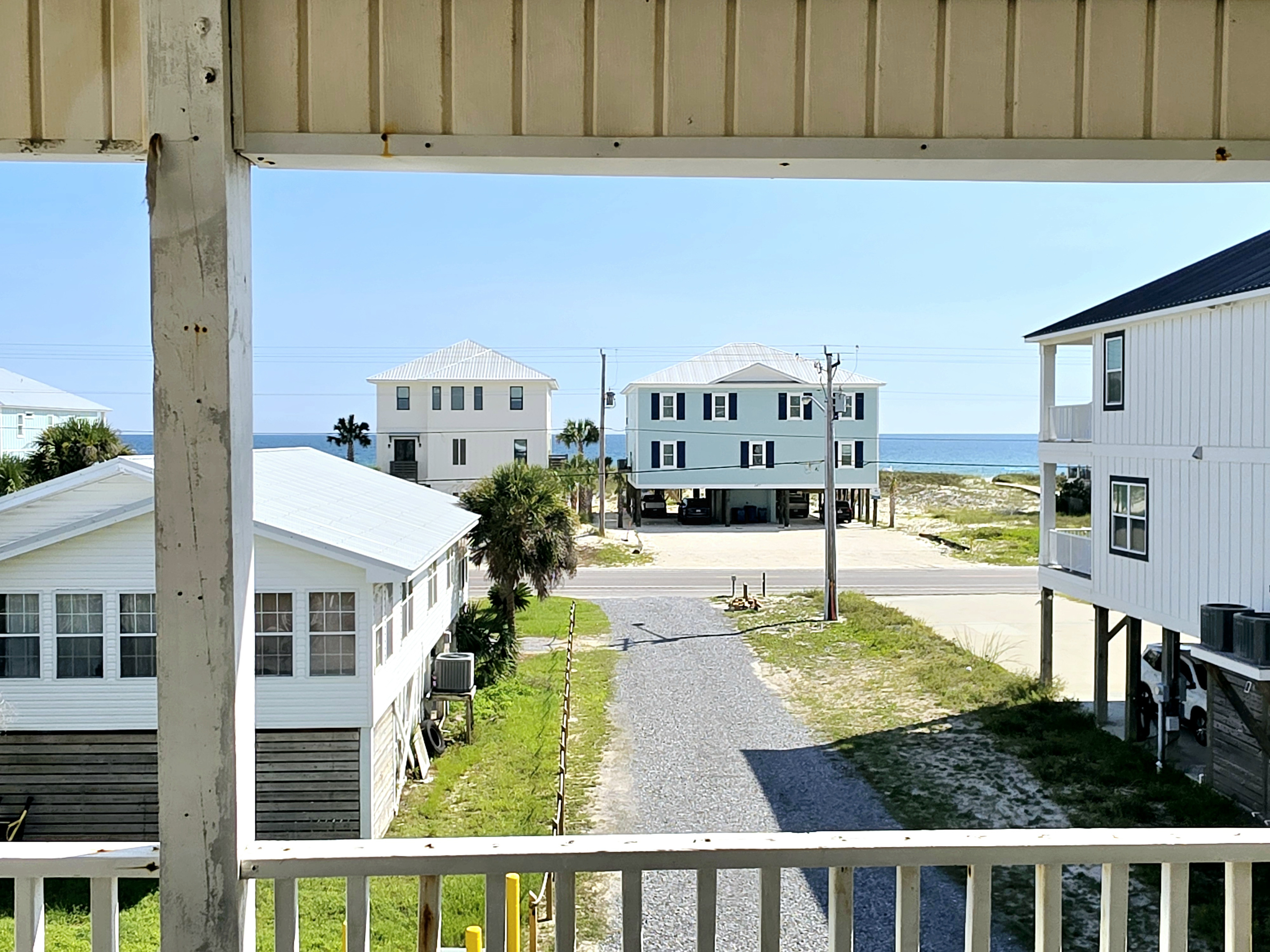 Balcony view down the street with the water in the distance