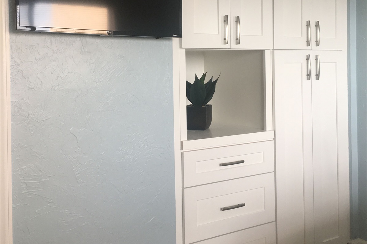 Guest bedroom custom closet and drawers. Smart flat screen TV
