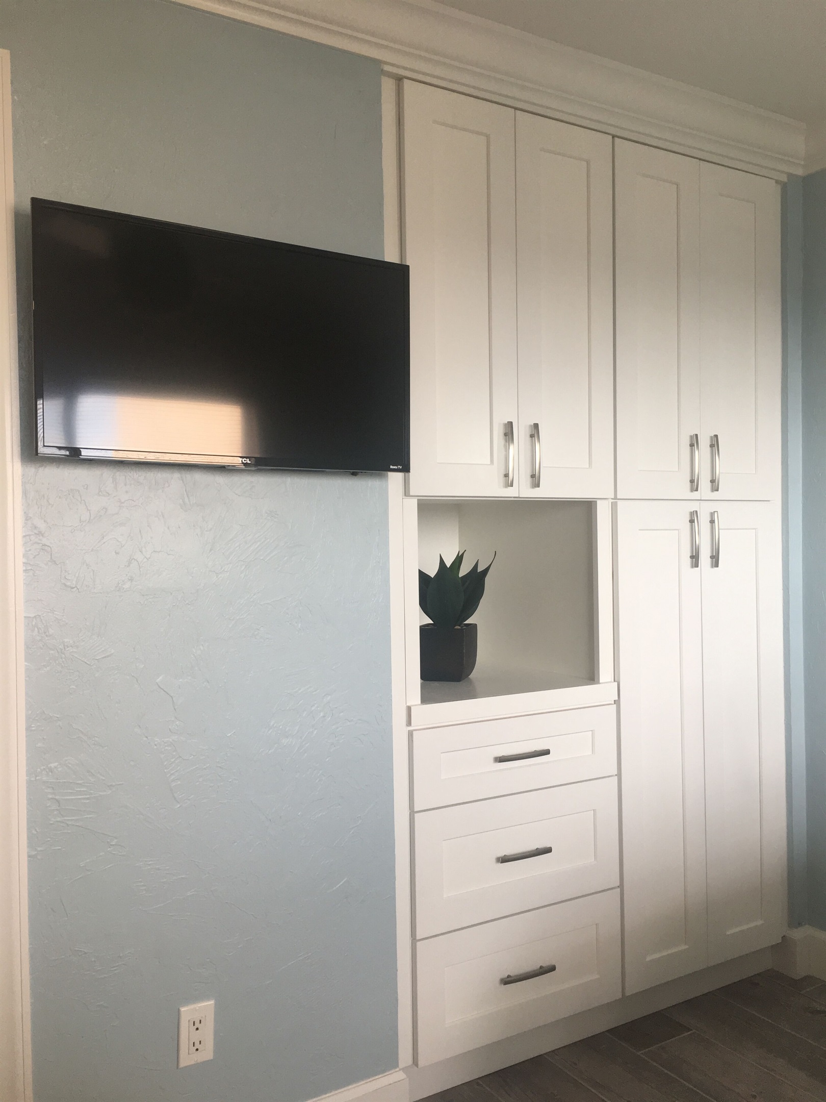 Guest bedroom custom closet and drawers. Smart flat screen TV