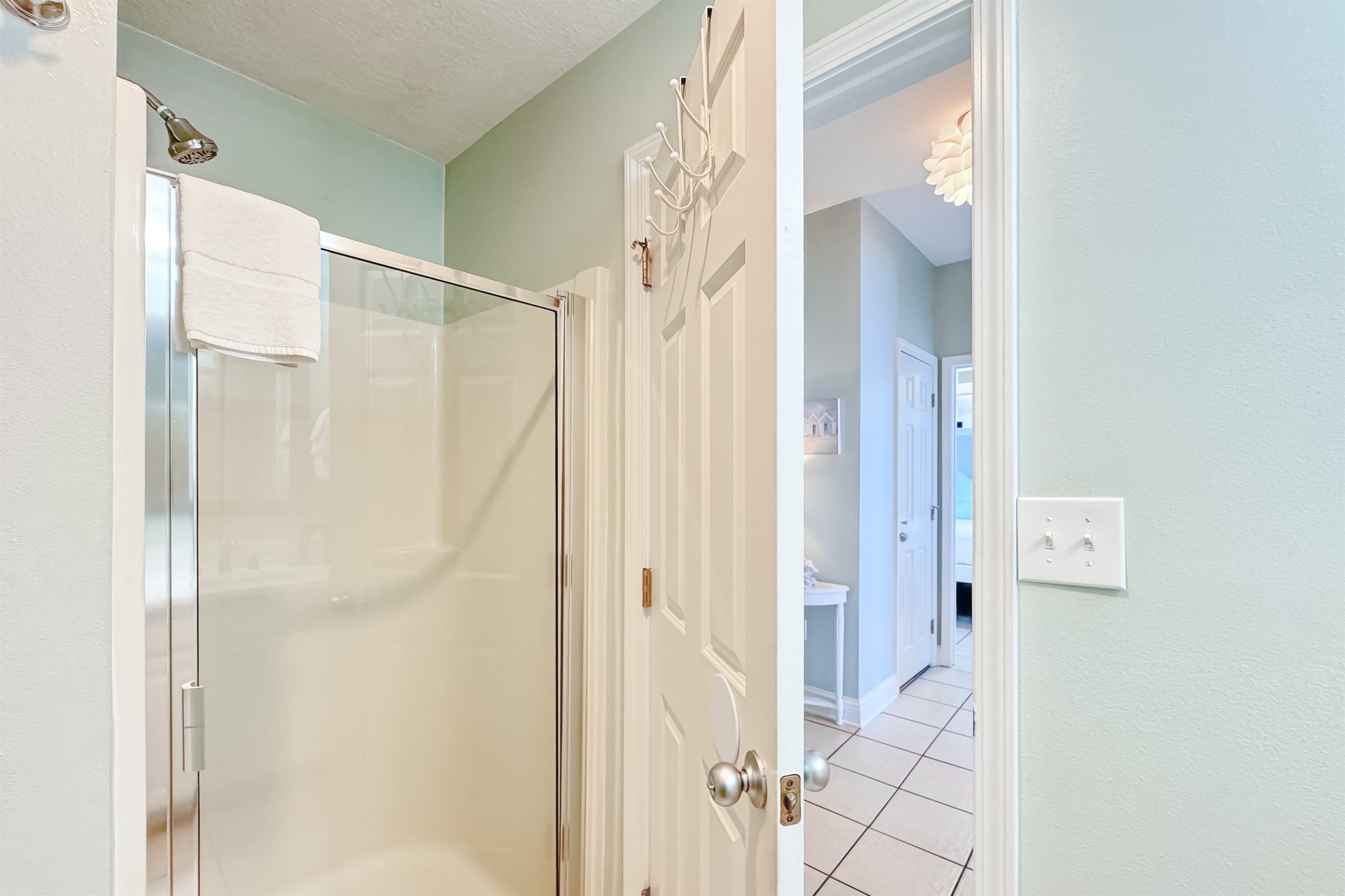 A bright and functional bathroom with walk-in shower designed for comfort. Enjoy a clean and refreshing space during your stay.