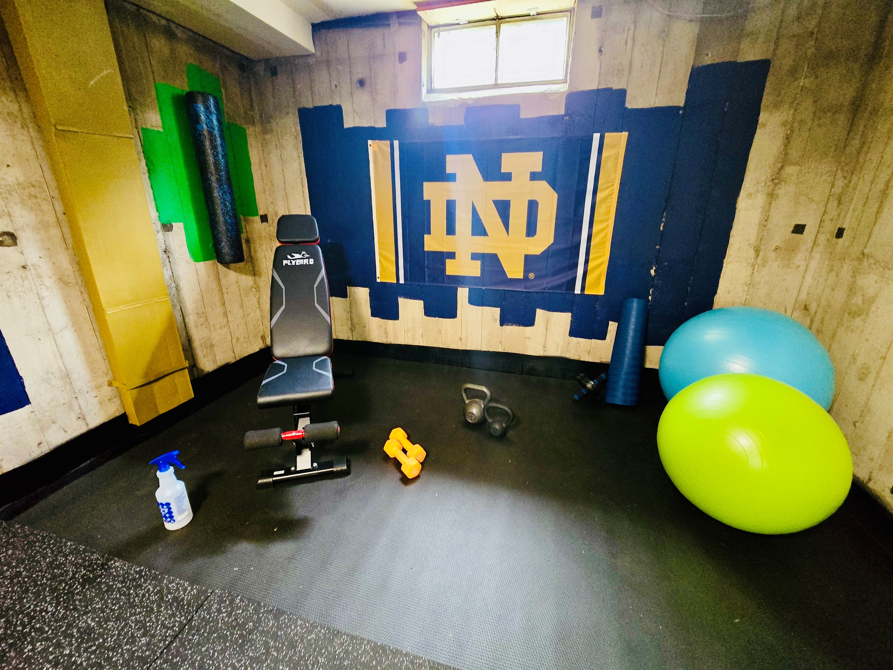 Fuel Your Focus, Channel the Irish Bold ND pride and vibrant gear set the tone—this basement gym is built to ignite your drive, elevate your mindset, and keep you moving toward your goals.
