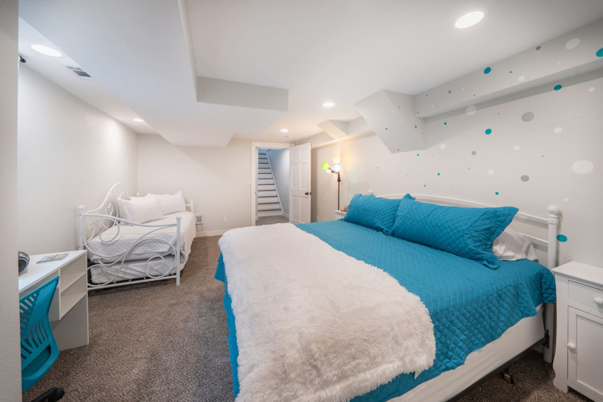 The 90's room has plenty of sleep space include a king size bed and a trundle bet with two singles that can be put together to form a king.