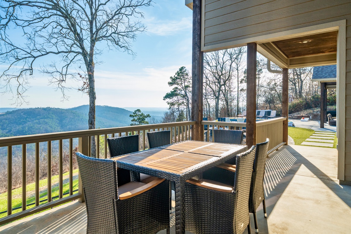 Enjoy meals outside at the covered dining table, where fresh air and wide-open views make everything taste better.