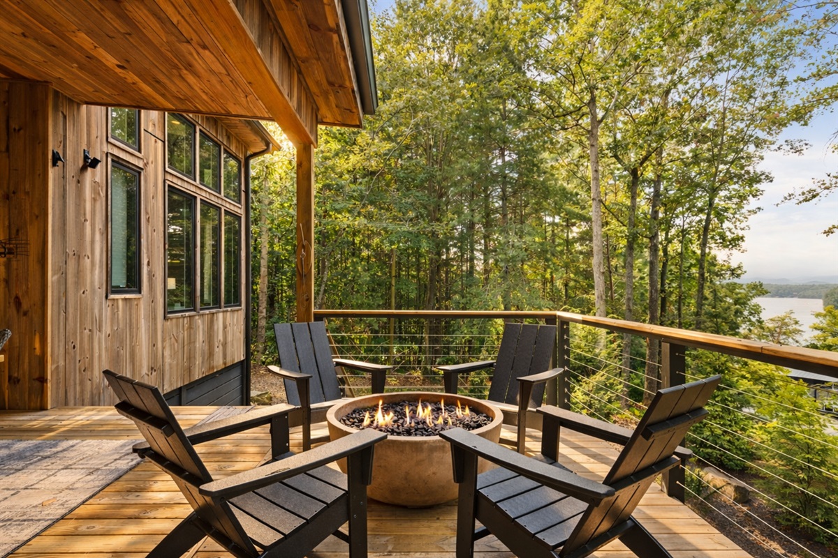 The covered deck offers a mix of seating options with stunning forest views and peaceful surroundings.
*Fire Pit (Available Year Round)
