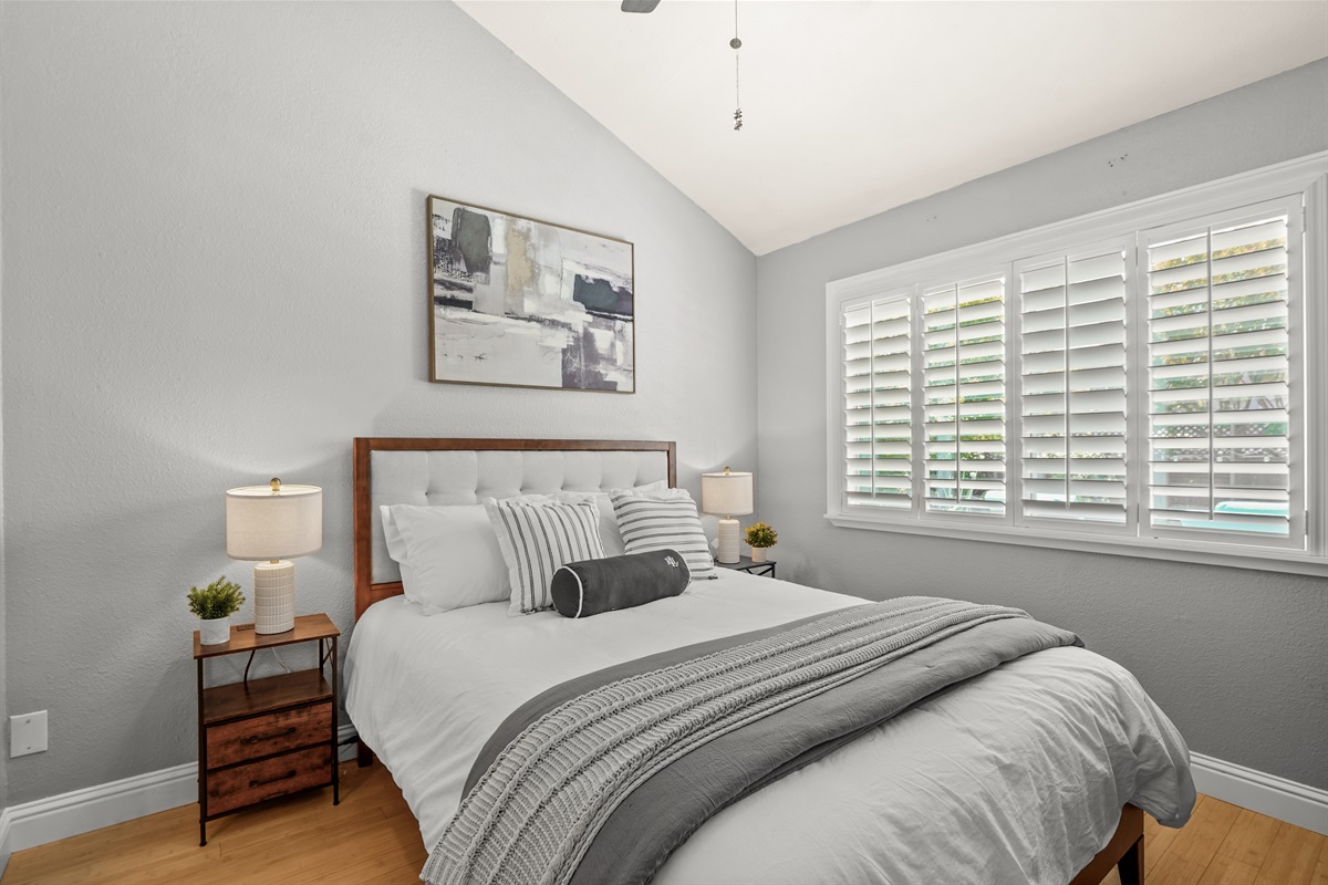 Bedroom 5 is conveniently located downstairs and features a comfortable queen bed, making it an ideal option for guests who prefer to avoid stairs or want additional privacy away from the upstairs bedrooms. With a cozy and relaxing atmosphere, this room pr