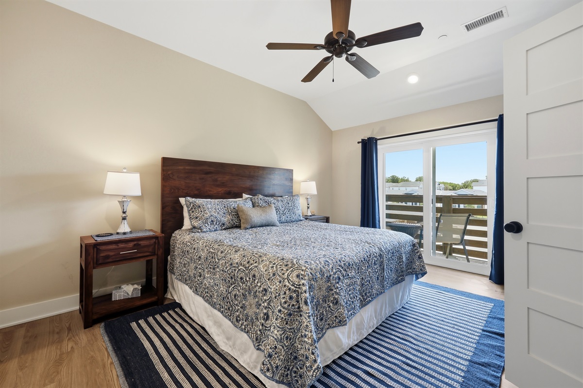 Spacious king bedroom with private ensuite bathroom and deck access