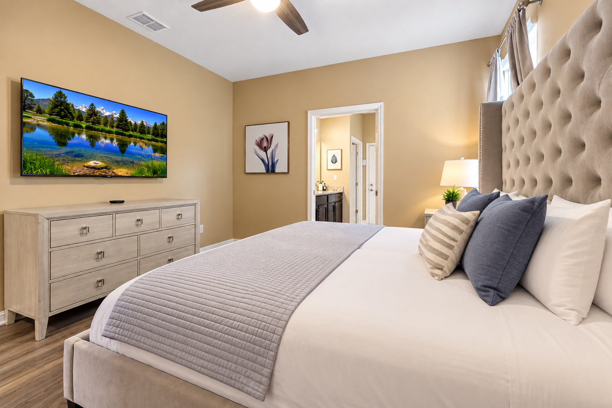 Our king-size master suite has many amenities, including a smart TV, ensuite bathroom, blackout curtains, and luxury linens.