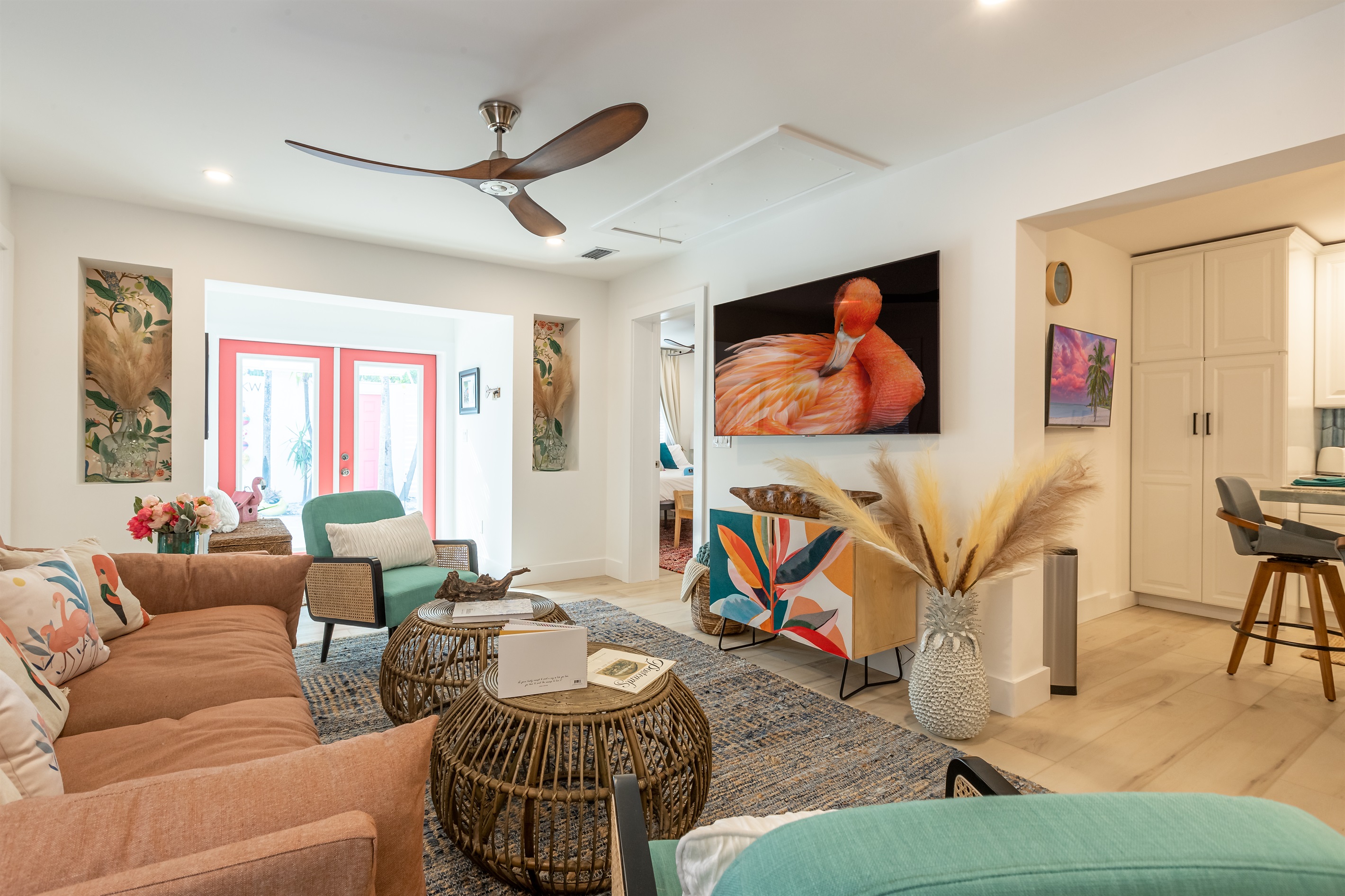 Living Room Oasis: Bright and inviting space with island-inspired decor and stunning art!