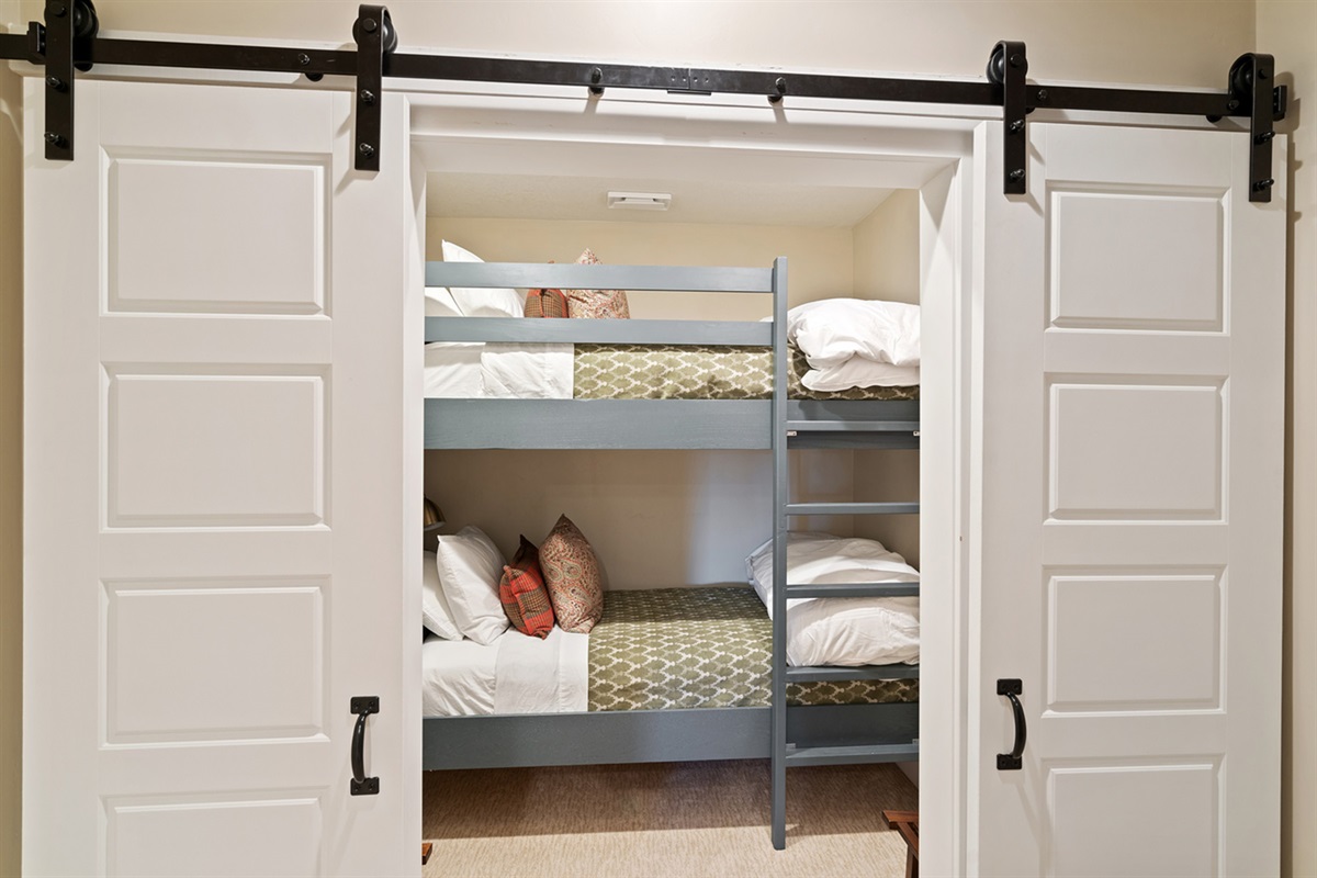 Fun bunk bed setup tucked into a cozy nook—great for kids.