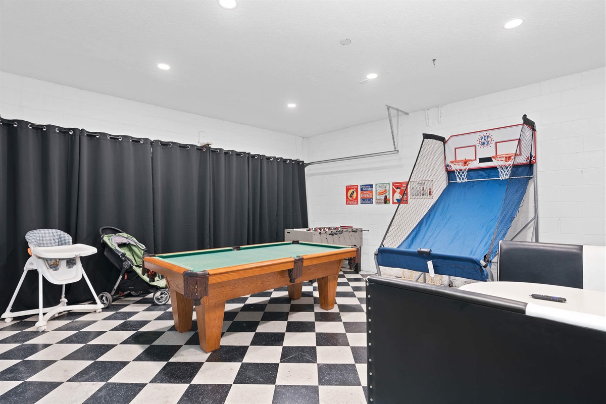 Gameroom with foosball, pool table, and basketball hoops game