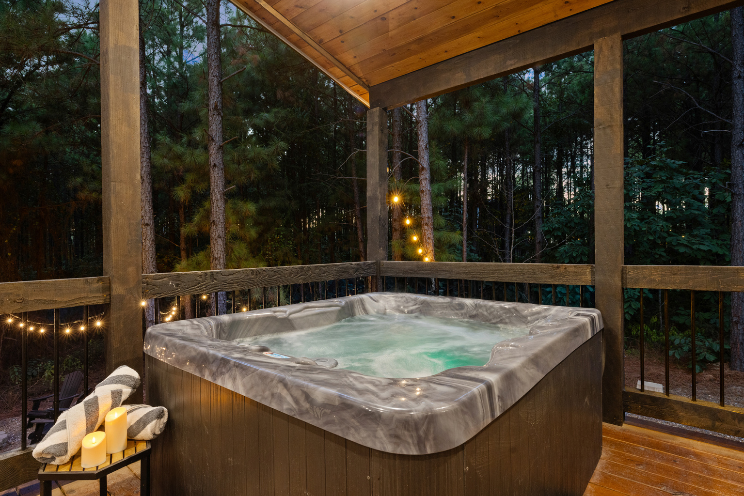 Sink into the hot tub beneath the pines, with peaceful woods behind you and nowhere you need to be.