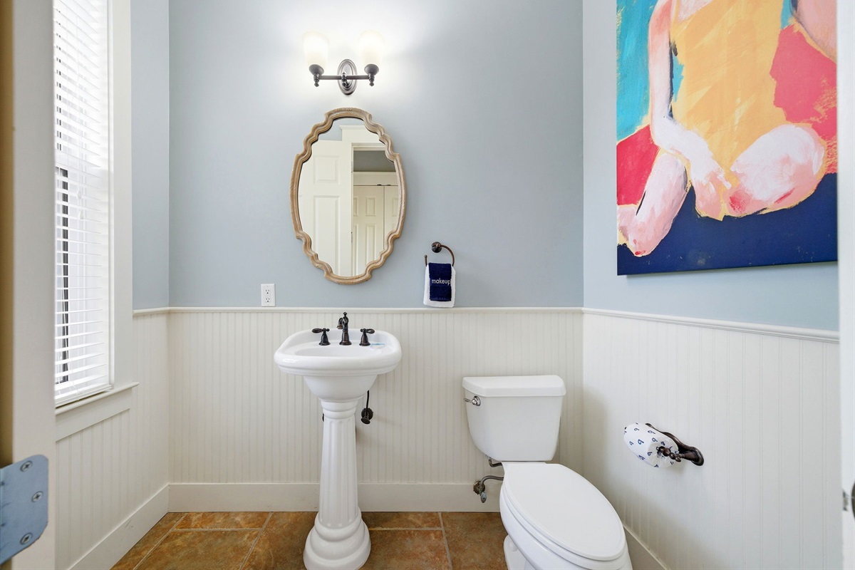 Main floor powder room, clean, bright, and ready for your arrival.