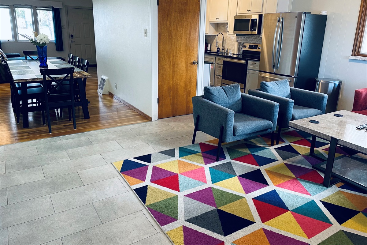 Living room connects with dining and kitchen