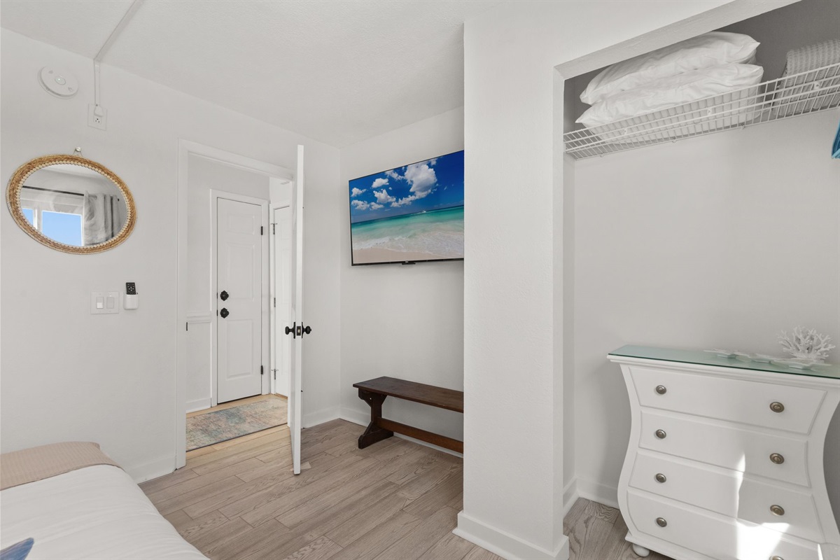 The bunk room also features a 55” Roku Smart TV, perfect for unwinding with your favorite shows after a day at the beach.