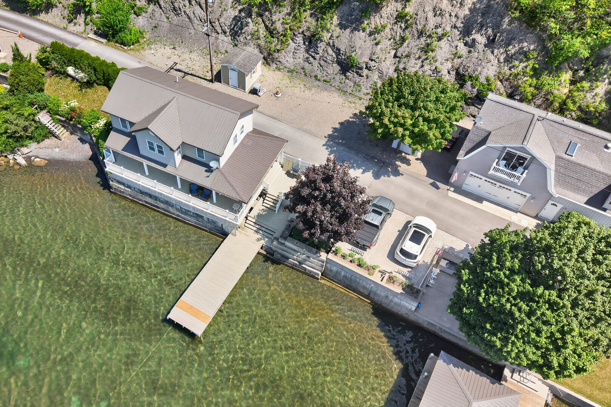 Home, lawn, and dock viewed from above