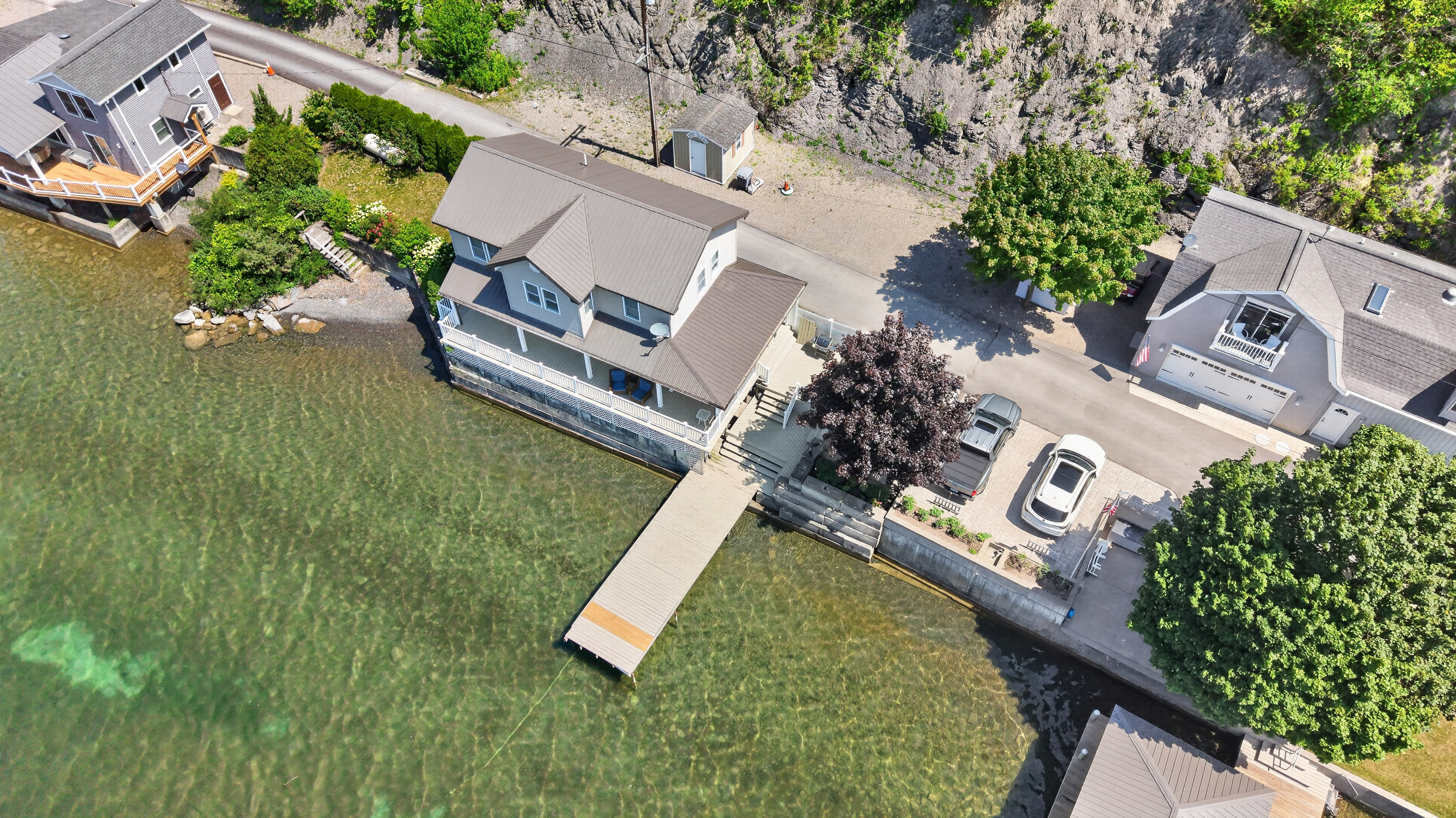 Home, lawn, and dock viewed from above