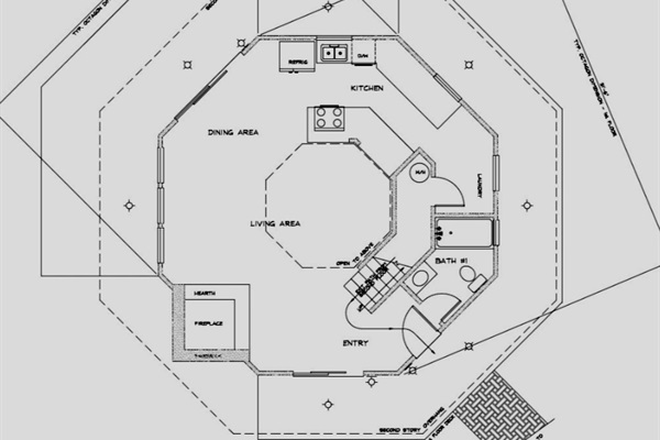 Floor plan of first floor w/ living room, kitchen, full bathroom, washer and dryer