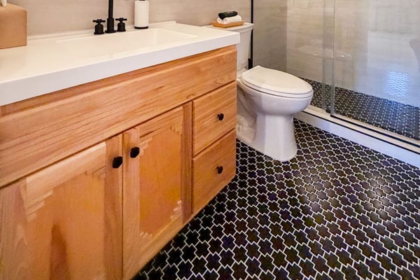 This stylish full bathroom is in our basement, entertainment area complete with shower, soft towels and all the soaps you will need