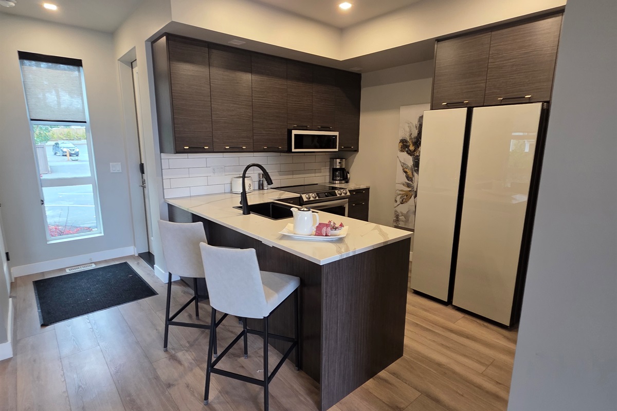 Bar seating. This well appointed kitchen is a Chef's delight. Under cupboard lights!