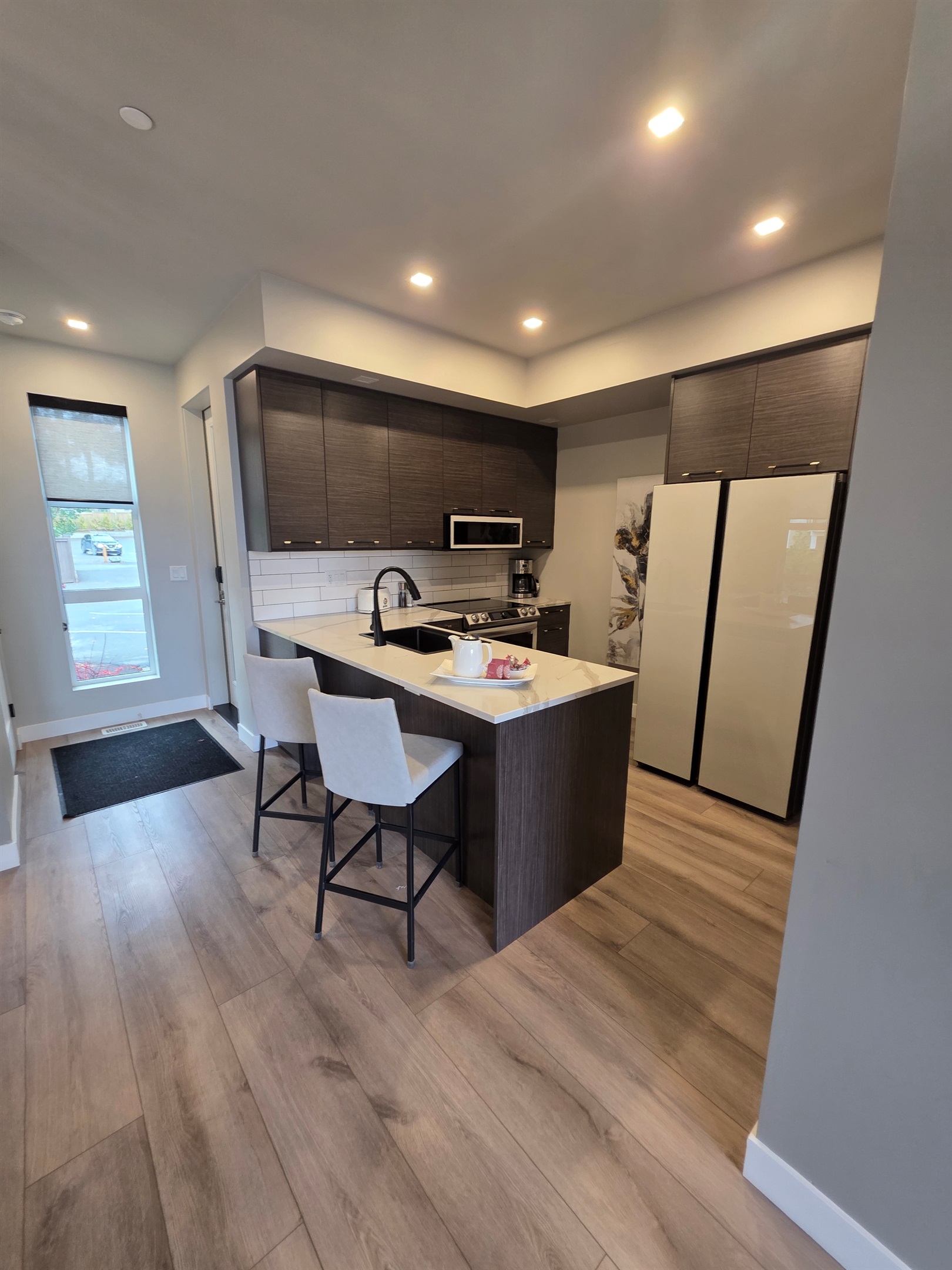 Bar seating. This well appointed kitchen is a Chef's delight. Under cupboard lights!