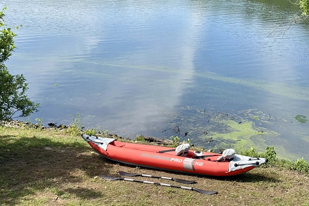 2 person kayak with fishing pole holders and 2 life jackets provided at house