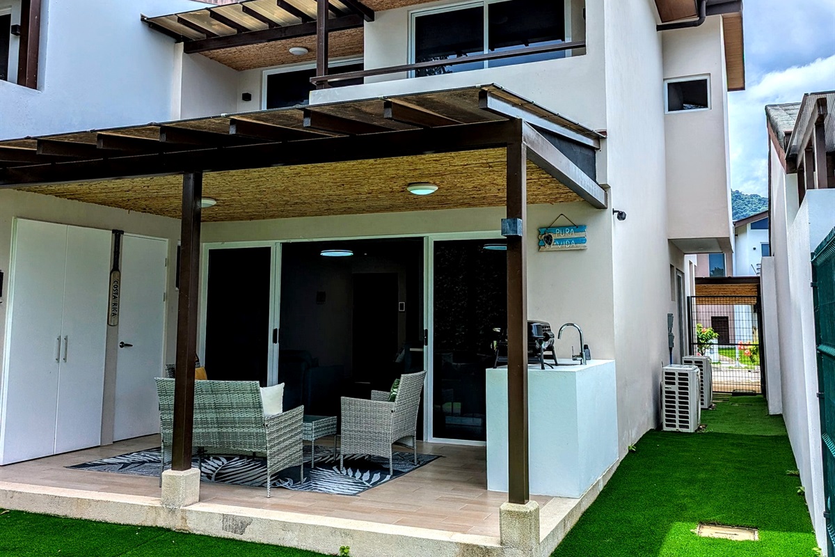 Side yard and covered patio, and balconies