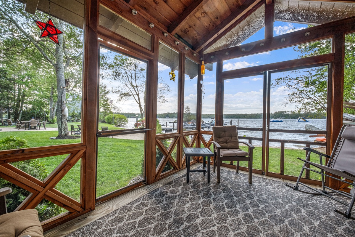 Outdoor screen gazebo overlooking lake and beach area