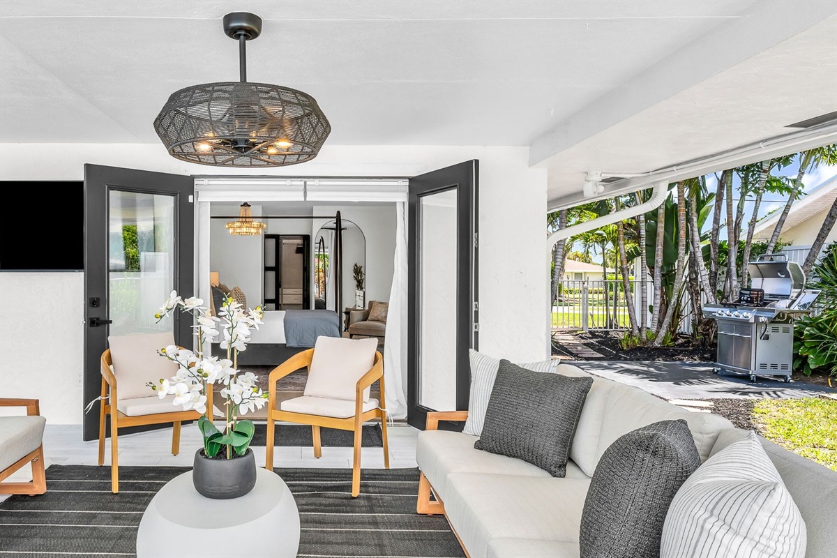 Designed for luxury and comfort, this outdoor space invites you to dine, relax, and unwind in true resort fashion. Enjoy poolside loungers, shaded patio seating, and an ambiance that blends modern elegance with the ease of Florida living
