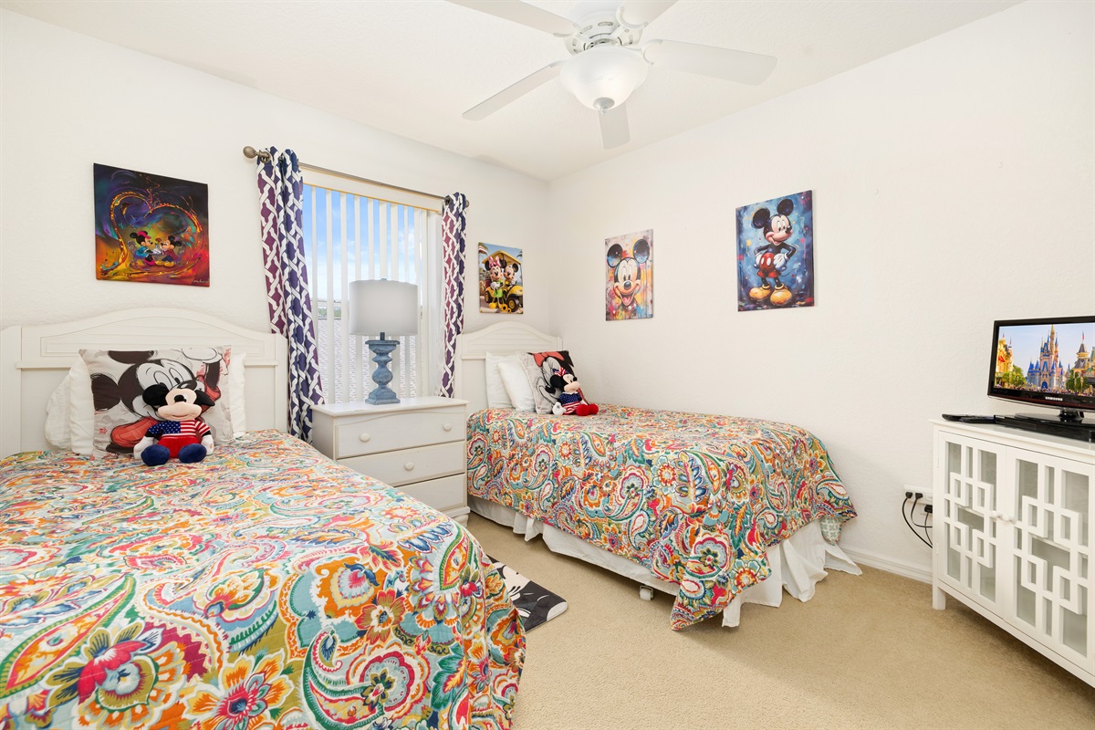 The newly redecorated Mickey room has two twin beds.